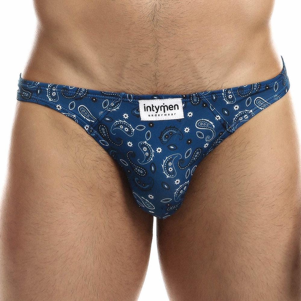 The Intymen Sexy Boy Paisley Bikini showcases a royal blue paisley print with a white intymen label on the waistband, offering a sleek, low-cut style that is bold and comfortable.