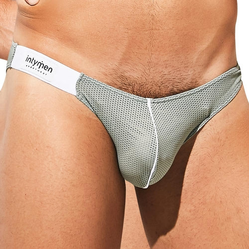 A person wearing the Intymen Fancy Brief with a low-waist design in gray and white. The focus is on the midsection, highlighting the front design and branding of this mens erotic underwear from Intymen.