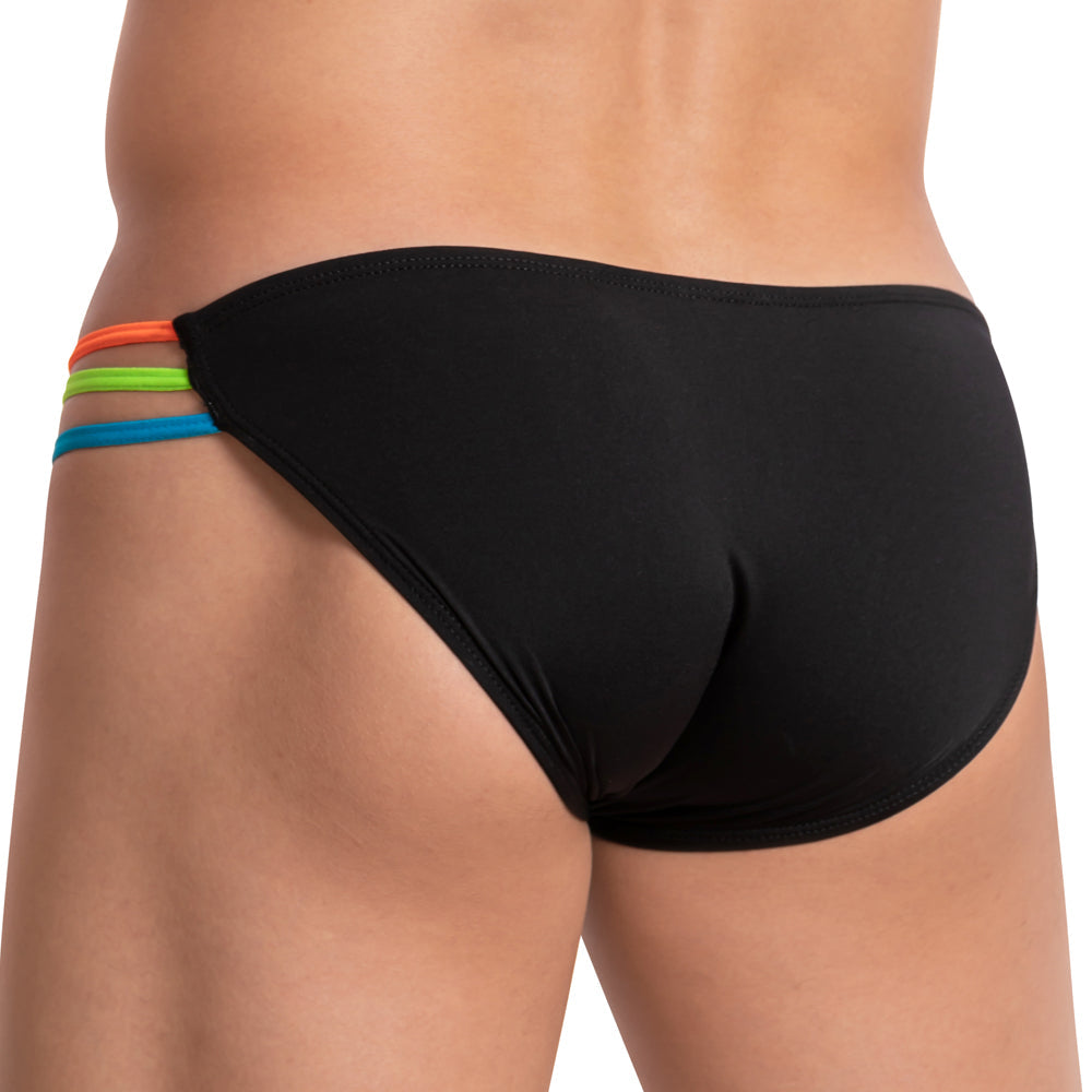The image features a close-up of someone wearing the Kyle High Voltage Bikini, highlighting black swim briefs with vibrant orange, green, and blue side straps on the left. It emphasizes seductive skin exposure through the back and side details.