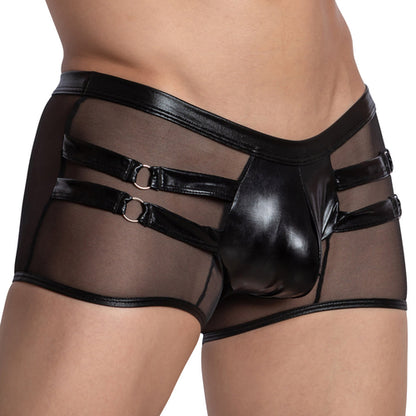 A person wears black mesh shorts with a shiny leather pouch and three side straps adorned with metal rings. The snug boxer fit blends transparent and solid materials, capturing the bold, edgy essence of Miami Jock Boxer Shiny Leather Pouch by Miami Jock.