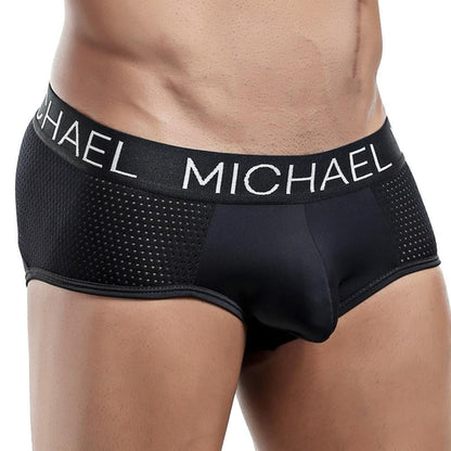 Wearing Michael Brief underwear by Michael showcases a sleek fit with side textures and Michael on the waistband, blending style, comfort, and support seamlessly.