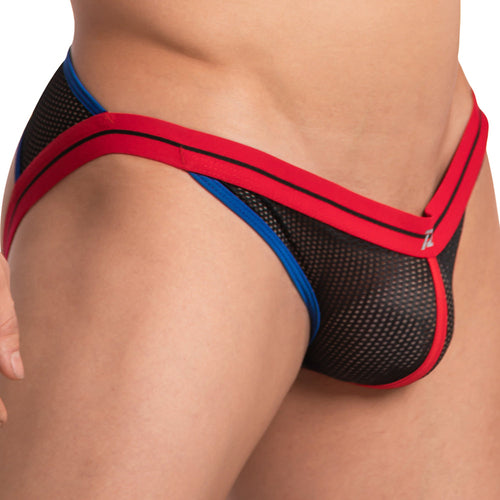 Close-up of a person wearing a black mesh Pistol Pete Pistol Pecker Jockstrap with red and blue trim, focusing on the waist and hip area to highlight the supportive pouch that showcases its design and texture.