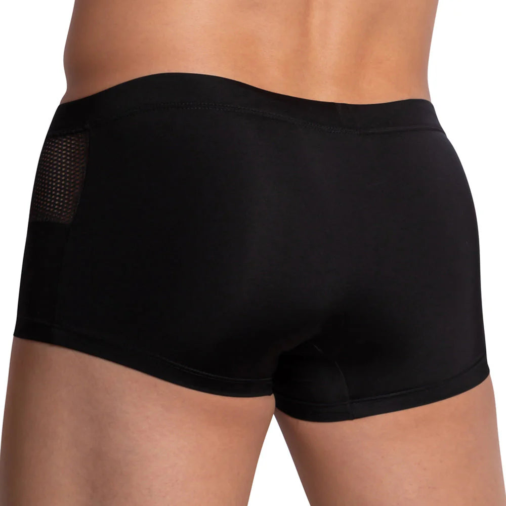 A person in Pistol Pete Side Mesh Boxer briefs with a contour pouch and side mesh paneling, shown from the back. The fabric looks smooth and fitted.