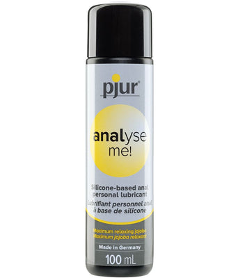 A 100 mL bottle of Pjur Analyze Me! Relaxing Anal Glide Silicone lube, in black and silver packaging, offers a German-made desensitizing formula with English and French text for enhanced comfort.