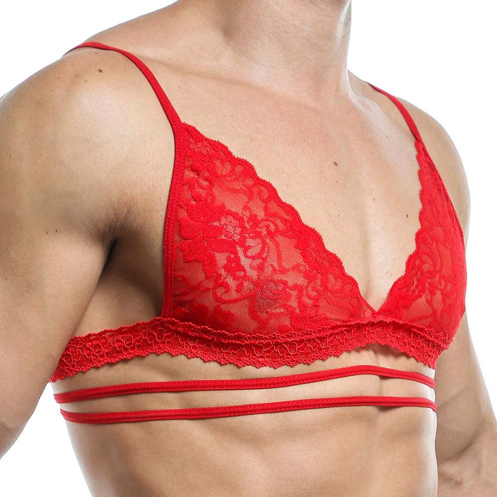 Wearing a Secret Male Tops lace bralette from Secret Male, with red fabric adorned in floral patterns and multiple thin straps, exudes a seductive silhouette. The triangular bust design enhances confidence, completed with decorative trim.