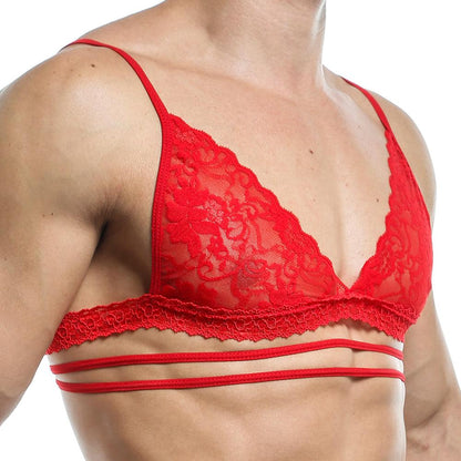 Wearing a Secret Male Tops lace bralette from Secret Male, with red fabric adorned in floral patterns and multiple thin straps, exudes a seductive silhouette. The triangular bust design enhances confidence, completed with decorative trim.