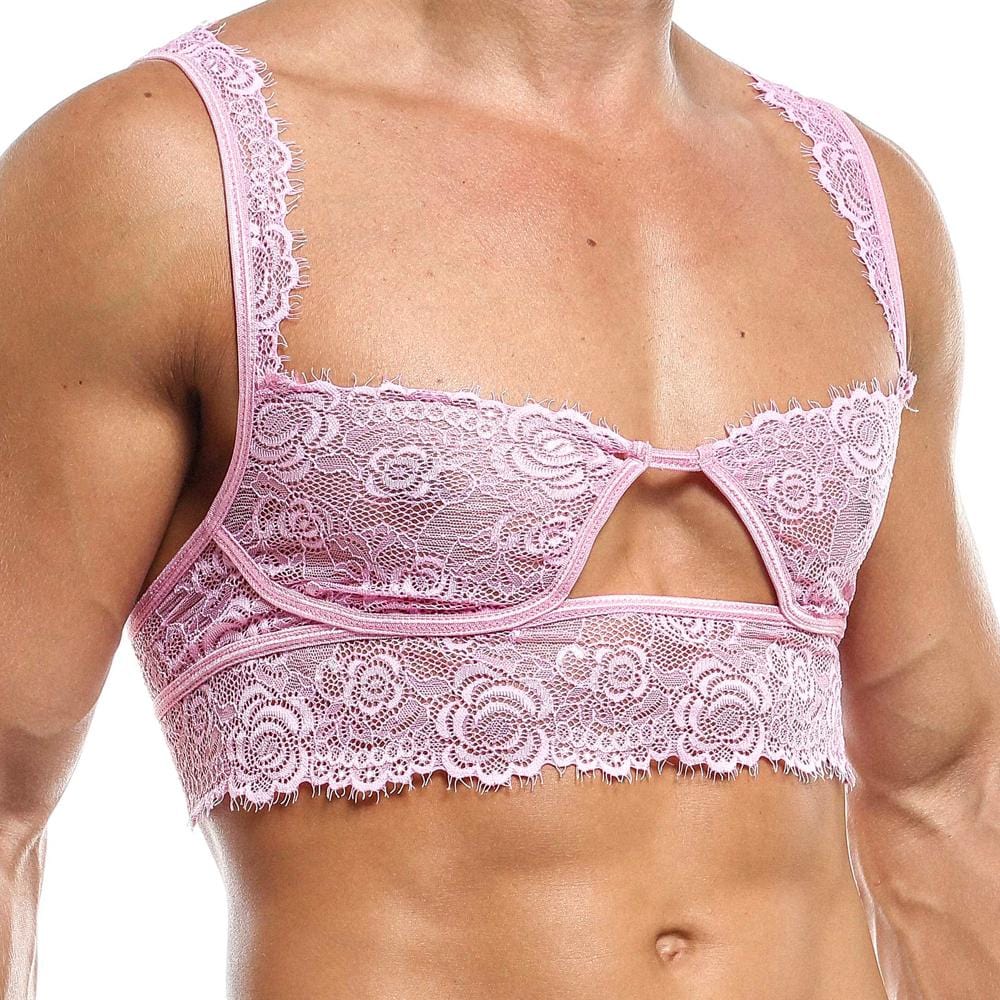A person in the Secret Male Low Cut Bra by Secret Male displays intimate mens fashion. The pink lace bralette boasts delicate floral patterns, a cutout design, thin lacy straps, and intricate edge detailing, elegantly highlighting seductive menswear from shoulder to waist.