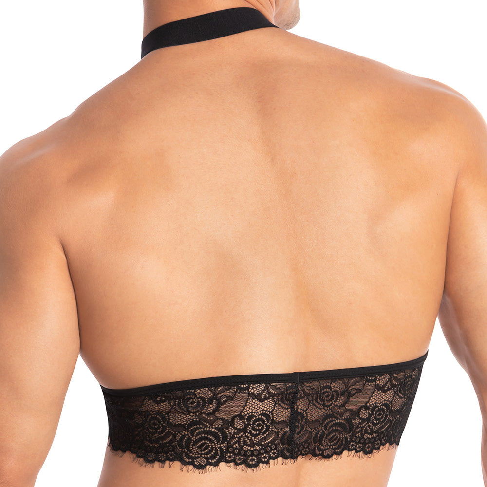 A person with a muscular back is highlighted in Secret Males Throbbin Top, a black lace bandeau featuring a halter strap. The intricate lace detailing redefines sexy mens fashion, showcasing the allure of male lingerie against the skin.