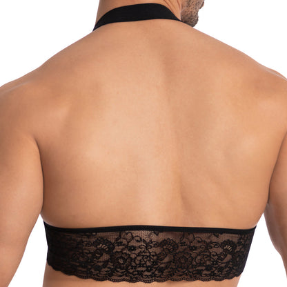 A person is seen from behind wearing the Secret Male SMA021 Gorgeous George Top, which features a wide band of intricate lace across the back and a thick neck strap, leaving their shoulders and upper back exposed.