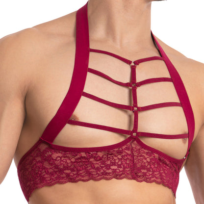 A person is wearing the Secret Male SMA021 Gorgeous George Top, a stylish red lace top featuring multiple horizontal straps across the chest for a sexy, form-fitting mens look.