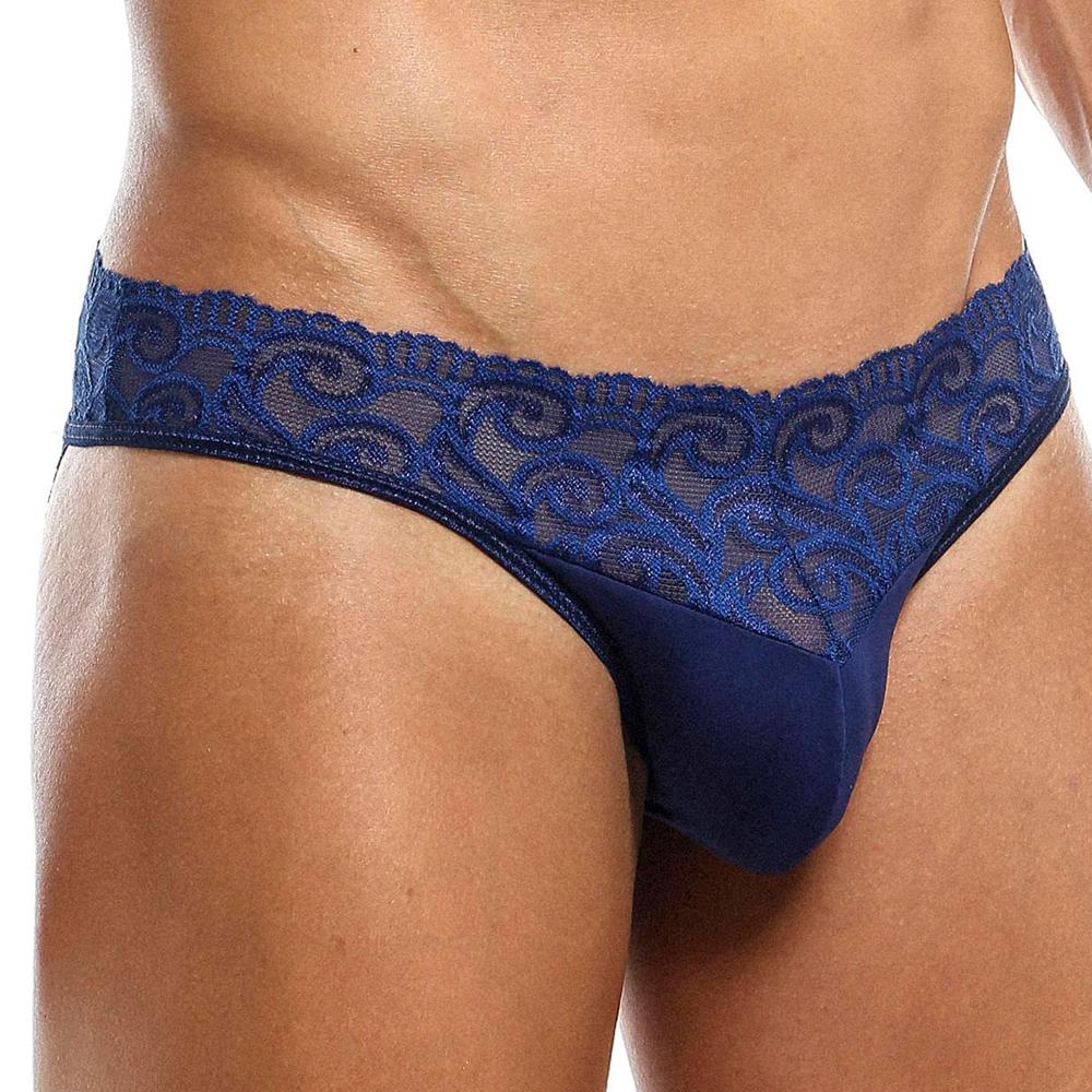 Wearing the Secret Male SMI025 Lace Bottom Bikini, a seductive dark blue lace design with floral details along the waistband complements light skin tones effortlessly.