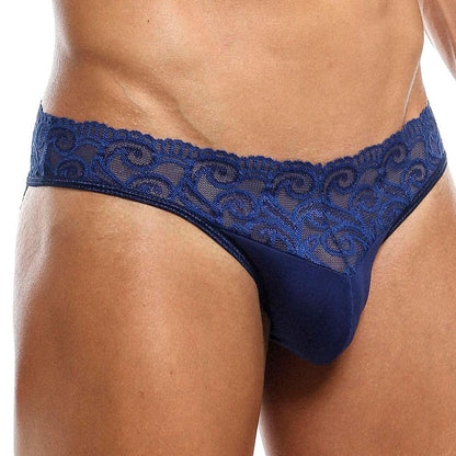 Wearing the Secret Male SMI025 Lace Bottom Bikini, a seductive dark blue lace design with floral details along the waistband complements light skin tones effortlessly.