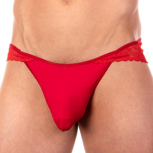 A close-up of a person wearing the Secret Male Carnation Bikini by Secret Male showcases the seductive see-through mesh and intricate red lace trim, highlighting the premium fabric blends detailed design and texture.