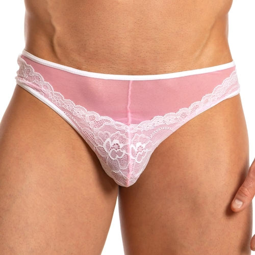 A person wearing the Secret Male French Maid Bikini in flirtatious pink sheer lace with white trim and chic floral front. Against a plain white background, comfort meets style in this charming design by Secret Male.