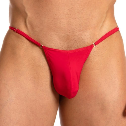 The image showcases a person wearing the Secret Male Lace Back Bikini in red, from waist to upper thighs, highlighting the flattering fit and style of this mens thong by Secret Male.