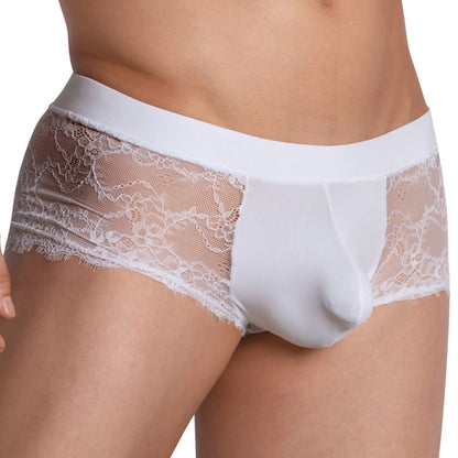 A person wearing Secret Male Sissy Mesh Bikinis showcases a seamless blend of floral lace and solid fabric, offering a snug fit with comfortable stretch material and delicate waistband and leg details.