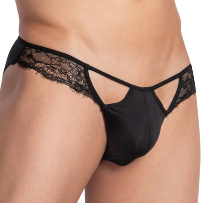 A close-up of someone wearing Secret Male Mesh Lace Bikini by Secret Male, featuring black mesh and lace with cutout detailing and a C-shape pouch. The combination of opaque fabric and decorative lace provides a stylish and modern look for enhanced comfort.