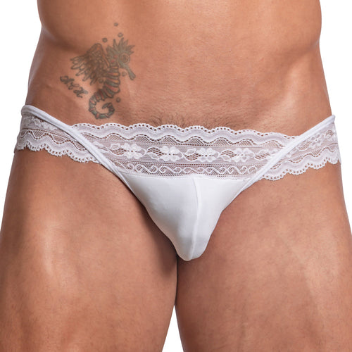 Wearing the Secret Male Sissy Garter Bikini, with its luxurious fabric blend and lace-trimmed white design, coupled with a tattoo on their upper torso, exudes confidence and elegance. This creation by Secret Male showcases comfort and style effortlessly.
