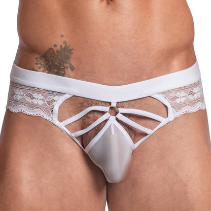 A person is wearing the Secret Male Steel Ring Sheer Bikini featuring white lace, sheer fabric, and a strappy design. Their torso tattoo is highlighted by the steel ring accents.