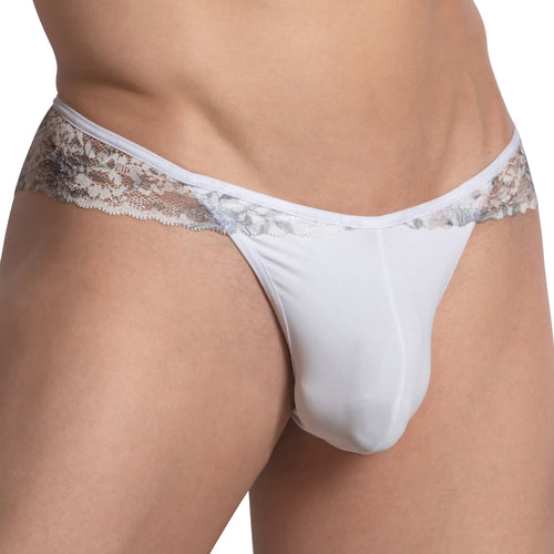 A person wears the Secret Male Open V-Back Bikini, showcasing white lace-trimmed underwear with intricate lace along the waistband, adding a decorative touch to this Secret Male design against a plain background.