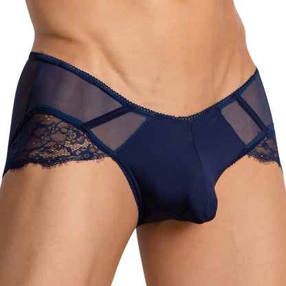 A person is wearing the Secret Male Low Rise Floral Bikini, which is navy blue and features lace and mesh details. The design includes a low-rise fit with floral lace edges and mesh panels near the waistband, emphasizing the midsection.