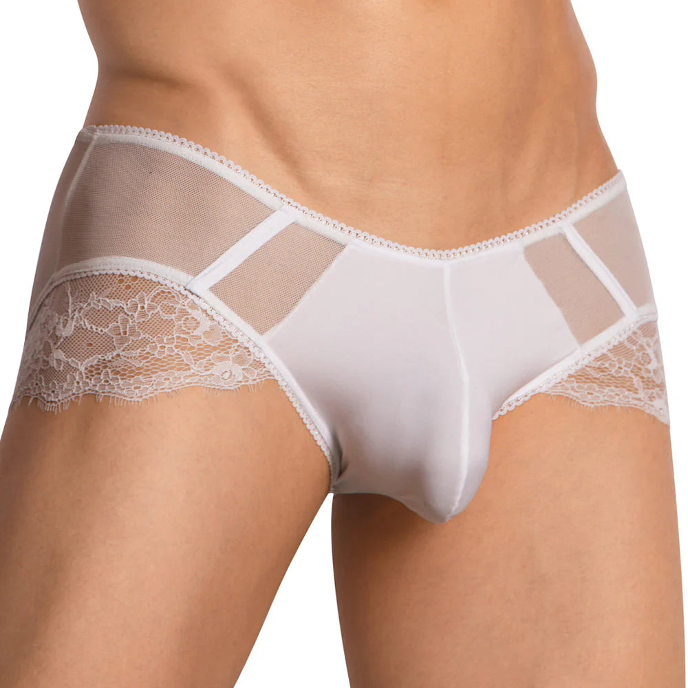 A person wearing Secret Males Low Rise Floral Bikini in elegant white, featuring delicate lace and mesh panels. Intricate side lacework offers a stylish and sophisticated look, while the comfortable fabric ensures a pleasant fit throughout the day.