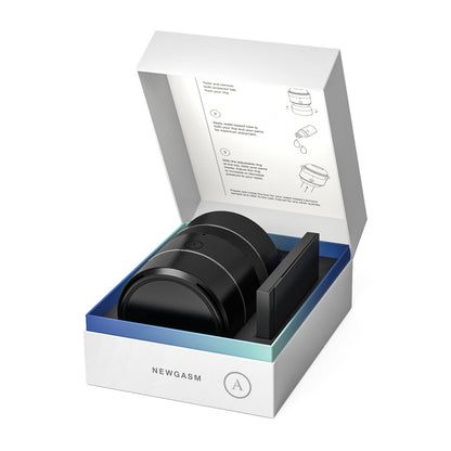 The open white box reveals the Arcwave Voy Compact Stroker in black, made with CleanTech silicone for an enhanced feel and hygiene. A small instruction card with line drawings is included. The box, labeled Arcwave, boasts a simple and modern packaging design.