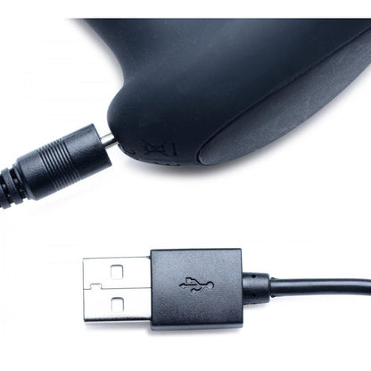 A close-up of a black USB cable with a USB Type-A connector, inspired by the Alpha Pro 7x P-Milker Prostate Stimulator with Milking Bead design, is plugged into a sleek black device. The focus on connectors against a white background highlights precision and innovation in electronics.