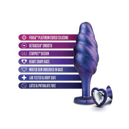 The Blush Anal Adventures Matrix Bumped Bling Plug by Blush Novelties is a purple spiral-shaped silicone plug with a heart base and sparkling gem. Made from PURIA™ platinum cured silicone and Ultrasilk™, its StayPut™ design ensures comfort, lab tested, and latex & phthalate free.