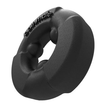 The Bathmate Gladiator Cock Ring by Adams Toy Box features a hollow center surrounded by raised bumps and engraved text on a textured, rugged black surface. Made with durable Elastomax for lasting use.