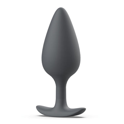 The Bfilled Bfilled Basic Plus is a smooth, seamless gray silicone butt plug with a tapered shape, narrow neck, and wide flat base for safety and comfort. Its matte and waterproof, making it great for anal play in various settings.