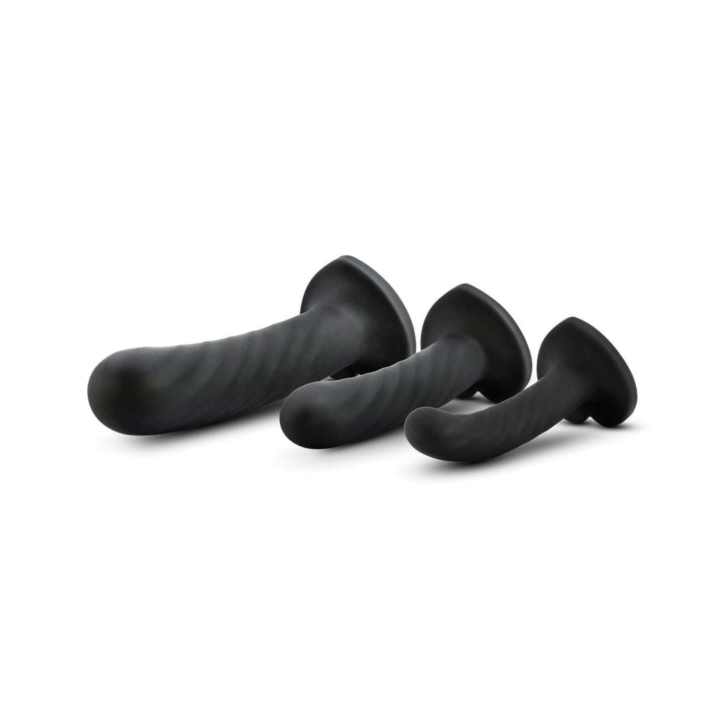 The Blush Temptasia Twist Kit by Blush Novelties includes three black silicone dildos in different sizes. Featuring smooth, curved designs and flared bases, each comes with a suction cup for versatile use, all showcased against a white background.