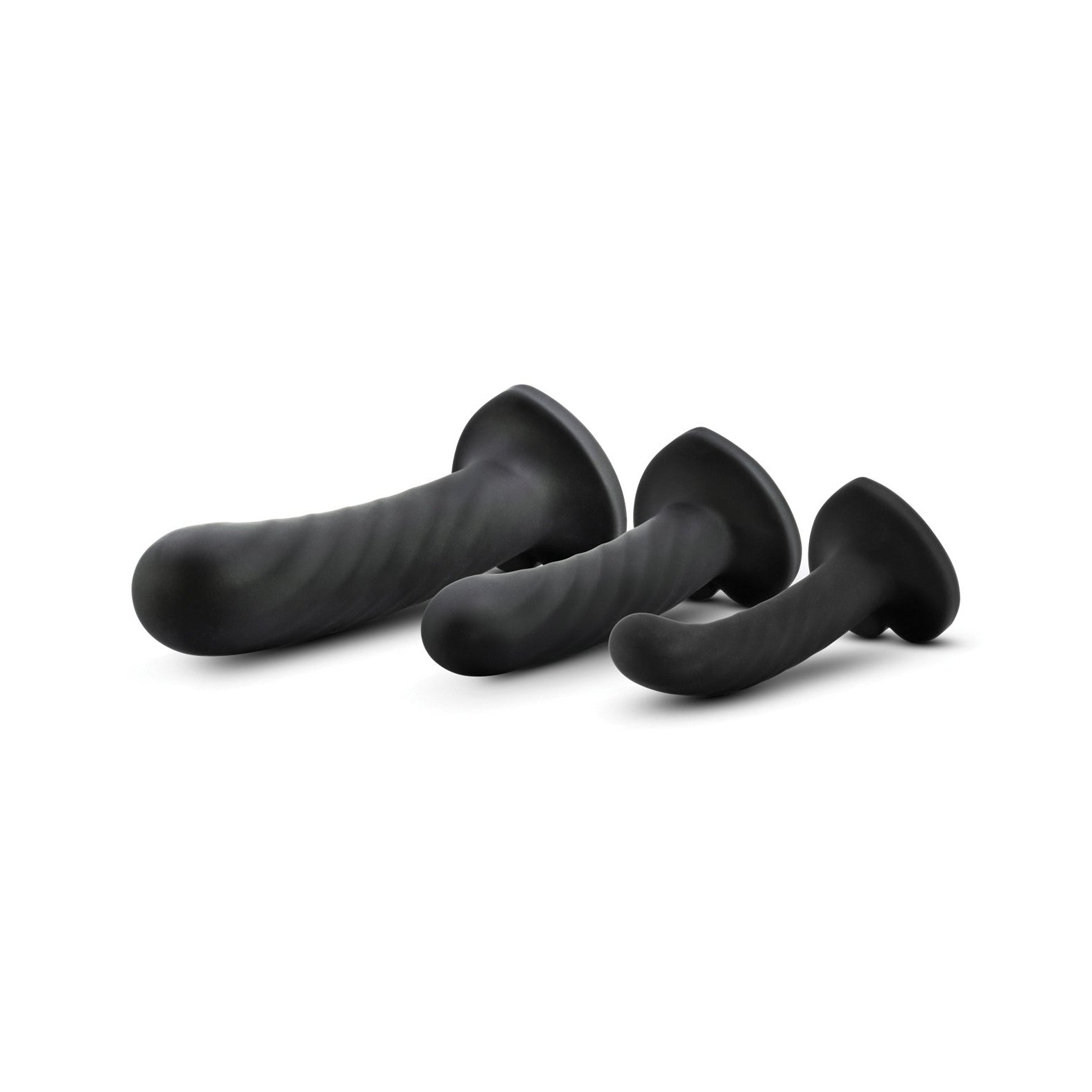 The Blush Temptasia Twist Kit by Blush Novelties includes three black silicone dildos in different sizes. Featuring smooth, curved designs and flared bases, each comes with a suction cup for versatile use, all showcased against a white background.