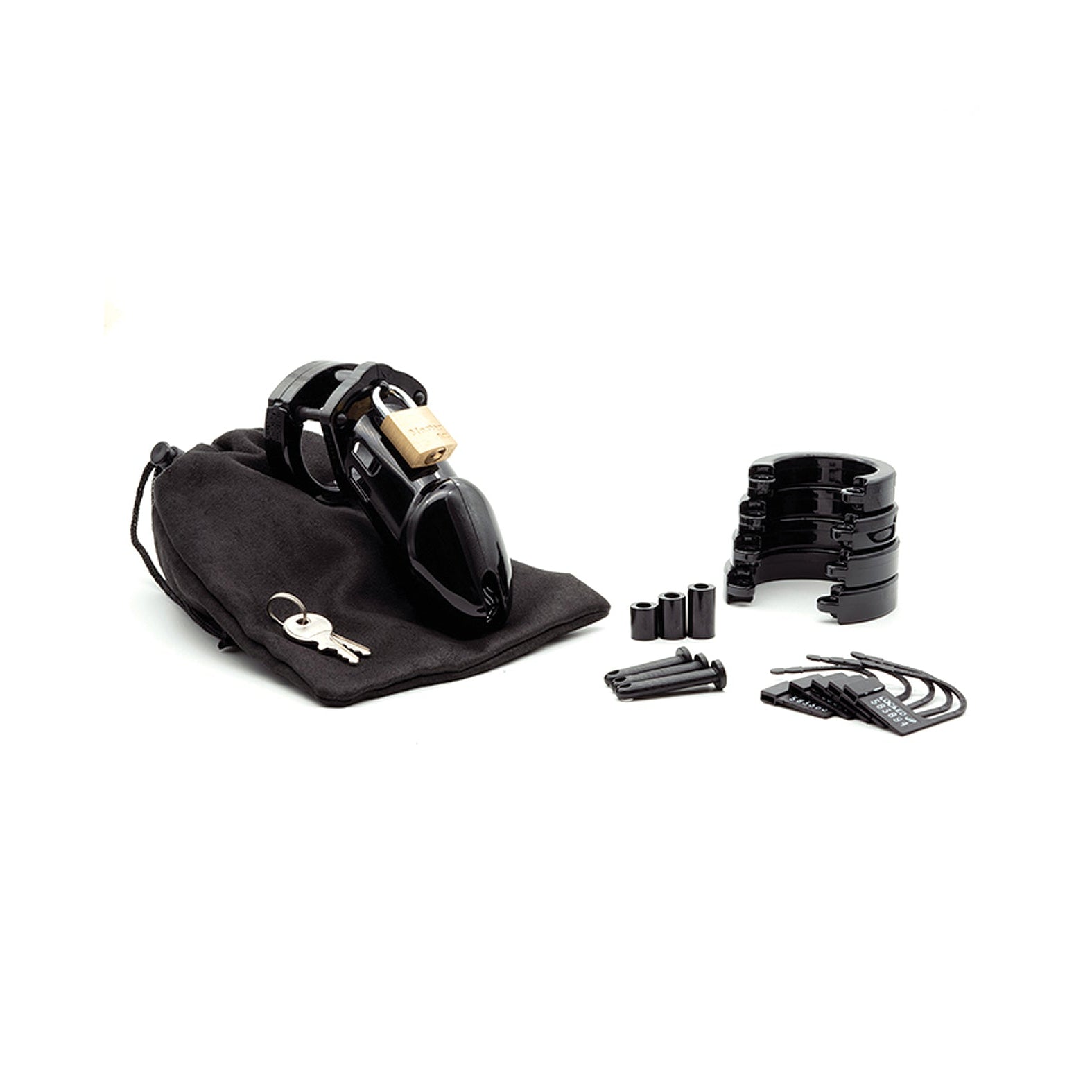 A black CB-6000 3 1/4 Cock Cage & Lock Set by CB-6000S features multiple pieces, rings, and spacers with a lock and set of keys on a black pouch. The dark accessories sharply contrast against the white background.
