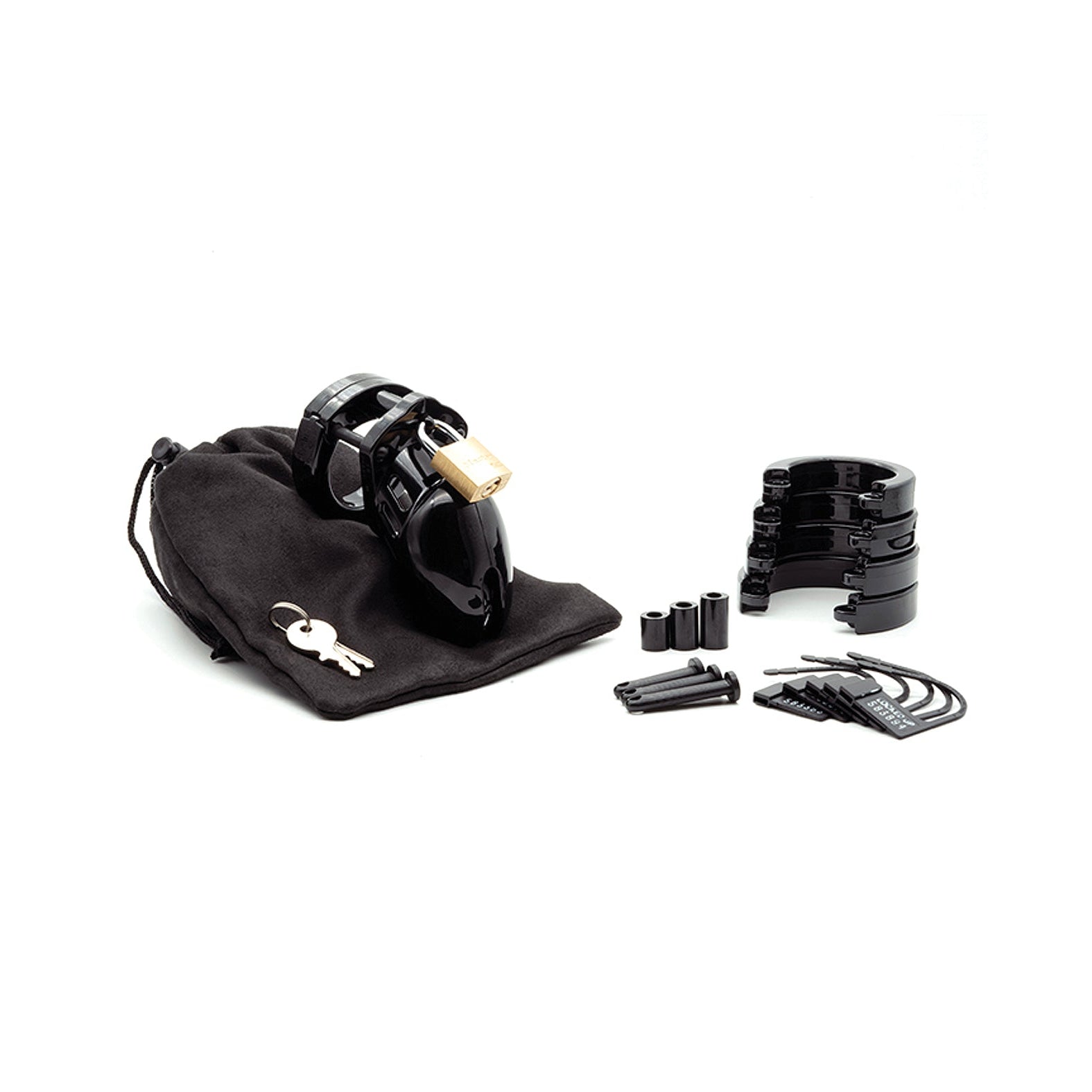 The black CB-6000S 2 1/2 Cock Cage & Lock Set, made from medical-grade polycarbonate, includes a gold lock, keys, adjustable rings, plastic spacers, and replacement pins, all neatly stored in a black drawstring pouch.