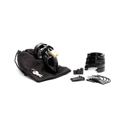 The black CB-6000S 2 1/2 Cock Cage & Lock Set, made from medical-grade polycarbonate, includes a gold lock, keys, adjustable rings, plastic spacers, and replacement pins, all neatly stored in a black drawstring pouch.