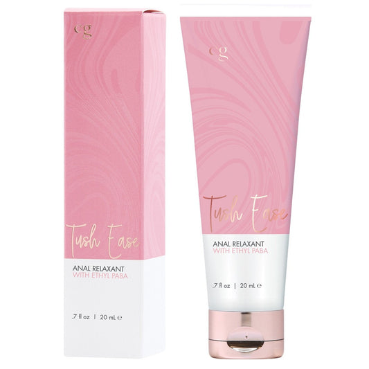 A pink and white tube labeled CGC Tush Ease Anal Gel with its matching box showcases the paraben-free formula, featuring Anal Relaxant with Ethyl Paba for gentle sensitivity reduction. The elegant packaging has subtle swirls, and the tube contains 0.7 fl oz (20 mL).