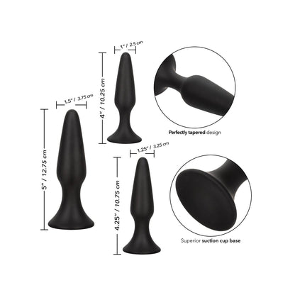 Image of the COLT Silicone Anal Trainer Kit by California Exotic Novelties, highlighting three body-safe silicone anal plugs ranging from 4 to 5 inches in height. Each plug features a perfectly tapered design and a superior suction cup base with measurement annotations included.