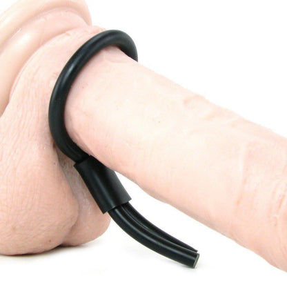 A close-up of the California Exotic Silicone Stud Lasso, a beige silicone cock ring by California Exotic Novelties with a black adjustable ring. Designed for comfort and enhanced stamina, it wraps securely around the cylindrical shape.