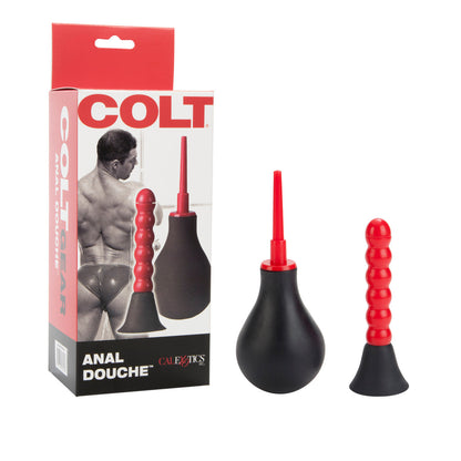 The black and red Colt Anal Douche set by California Exotic Novelties is displayed next to its packaging, featuring a grayscale image of a muscular figure in briefs. Bold red and black lettering highlights the importance of intimate hygiene for backdoor fun.