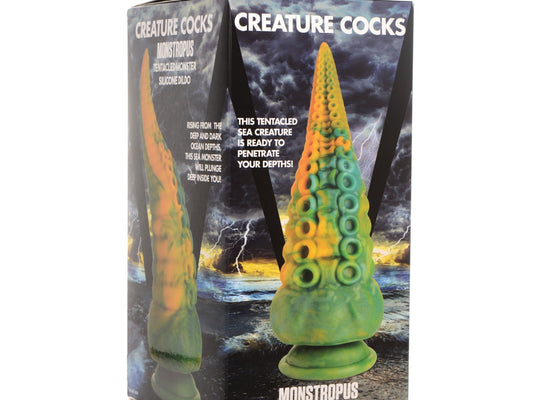 The product packaging for the Creature Cocks Monstropus Tentacled Monster Silicone Dildo features a vibrant green and orange silicone tentacle-shaped dildo against a backdrop of a dark, stormy sea, with text branding it as a tentacled monster.
