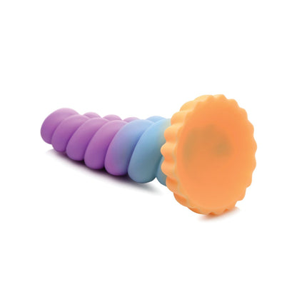 The colorful Creature Cocks Unicorn Silicone Dildo, by Creature Cocks, features a pastel spiral design in shades of purple, blue, and orange on a white base.