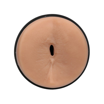 The Man Squeeze ULTRASKYN Ass Stroker - Pierce Paris by Doc Johnson is a cylindrical, smooth-surfaced beige object with a central opening, puck-like in shape and made from ULTRASKYN for a soft, rubbery feel.
