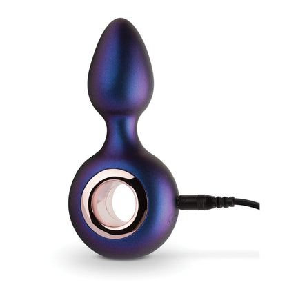 The Hueman Deep Space Vibrating Anal Plug by Hueman is a metallic purple device with a bulbous top, circular base with rose gold ring, and offers 10 vibration settings. Complete with a charging cable, it ensures a sleek and modern silicone sensation.
