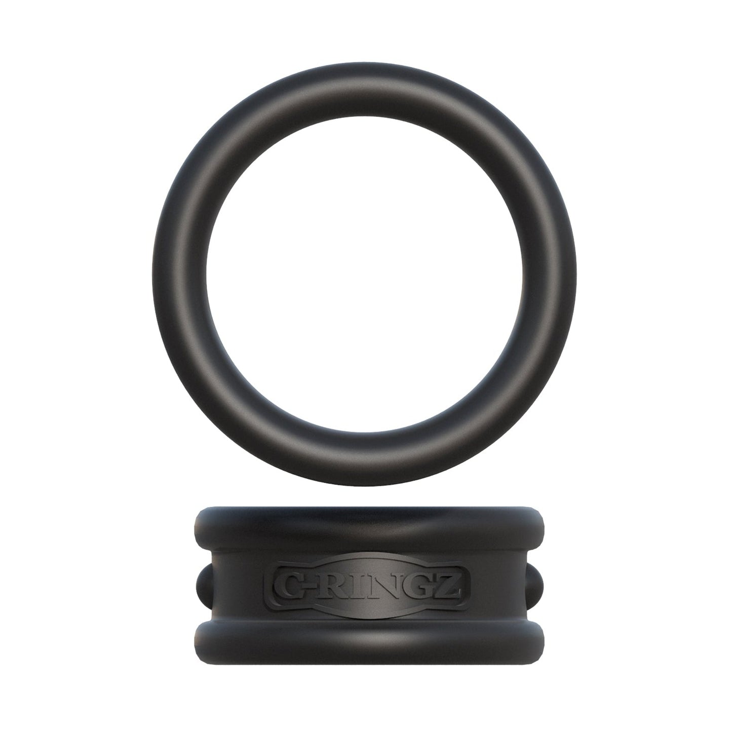 The Fantasy C-Ringz Max Width Silicone Cock Rings by Pipedream Products features a black silicone cock ring resting on a rectangular silicone block with embossed text, crafted from body-safe material. The ring and block are separate pieces, with grooves and raised lettering, isolated on a white background.