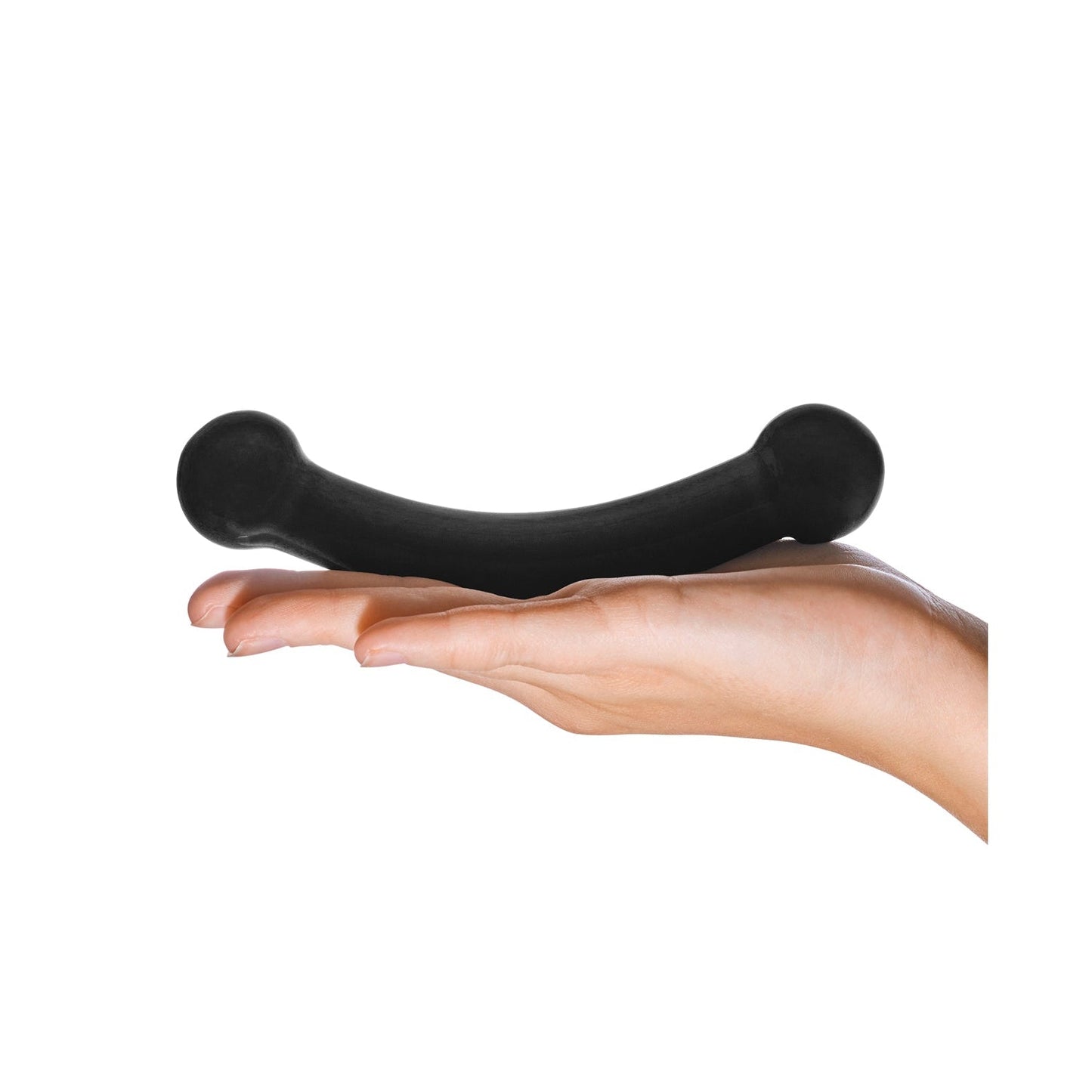 A hand holds the sleek Glas Double Bull Glass Dildo - Black, an S-shaped object from Glas designed for p-spot stimulation, with rounded ends promising enhanced sensations against a white background.