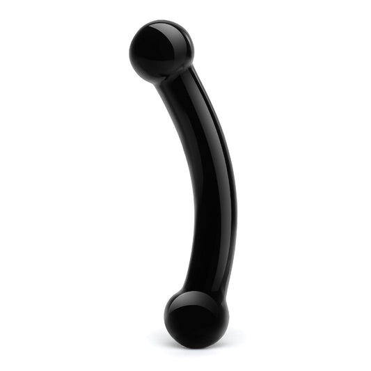 The Glas Double Bull Glass Dildo - Black by Glas is a black, curved object with rounded ends, resembling a minimalist sculpture or modern ergonomic tool for p-spot stimulation, set against a white background.