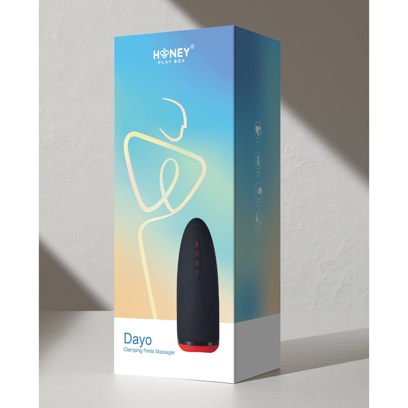 A product box labeled Honey Play Box features a black device with red accents on a gradient backdrop, showcasing the Dayo Autoblowjob Clamping Penis Massager and highlighting its automatic clamping technology for an enhanced experience.