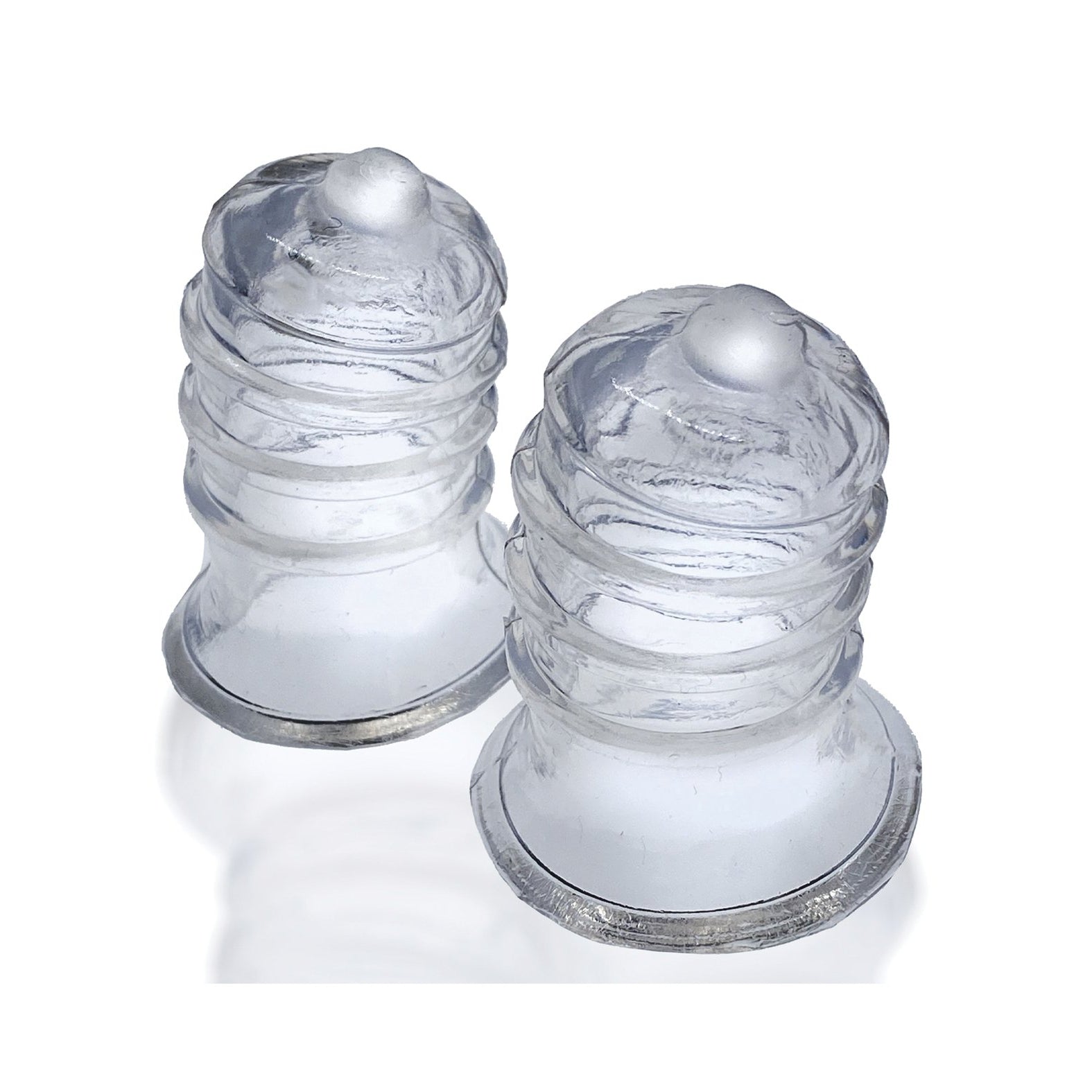 Two Hunky Junk Elong Nipsuckers, transparent silicone cups with a rounded, ribbed design for cupping therapy, are placed side by side on a white background.
