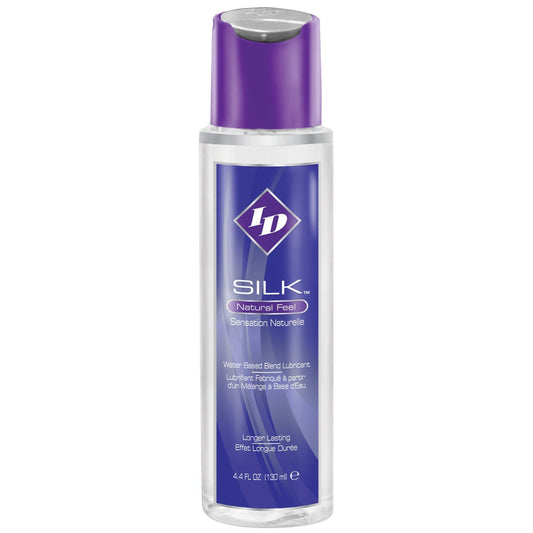 The ID Silk Natural Feel Lubricant by ID is a hybrid personal lubricant in a clear bottle with a purple cap. Its label, featuring white text, highlights its long-lasting, water-based formulation for a natural feel. It has a capacity of 4.4 fl oz (130 mL).